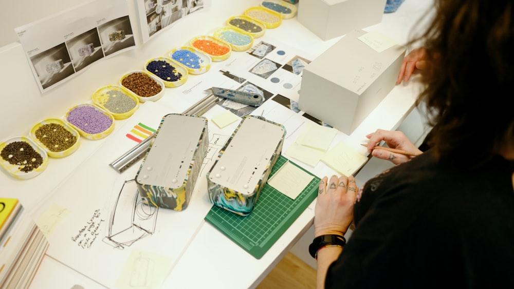 a woman working on a project at a table