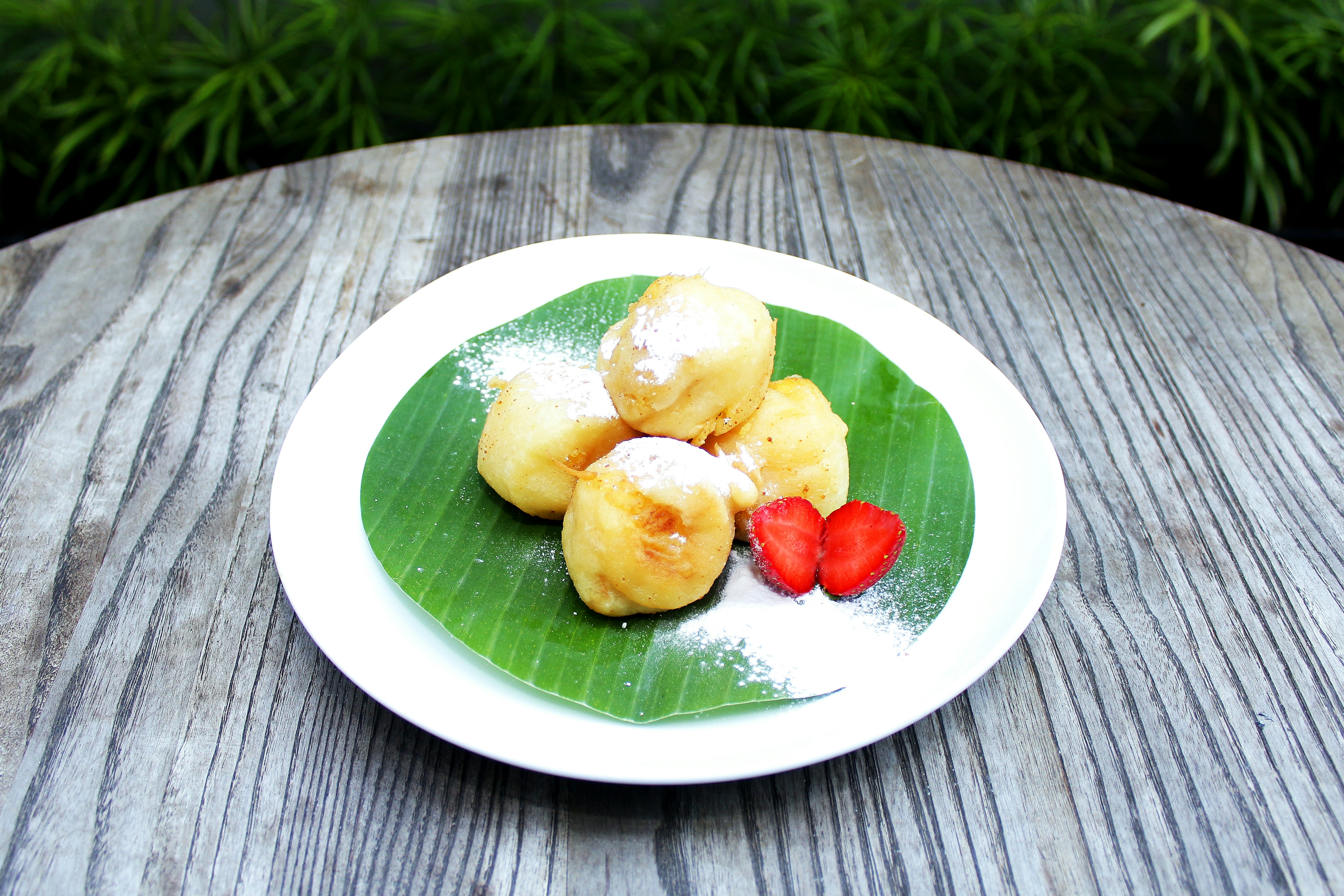 a plate of food on a wooden table