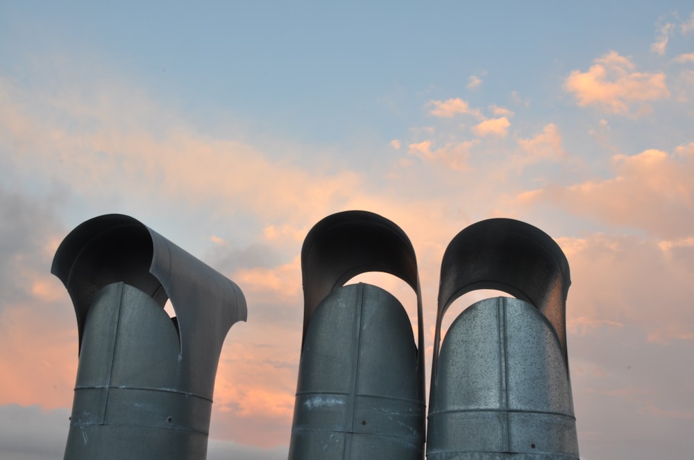 a couple of metal pipes sitting next to each other