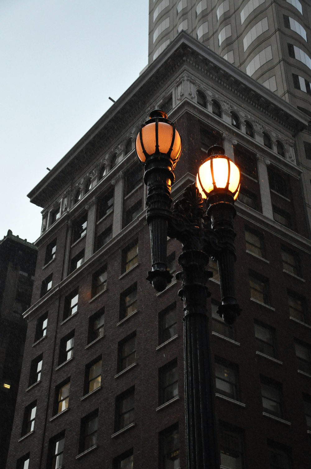 a street light in front of a tall building