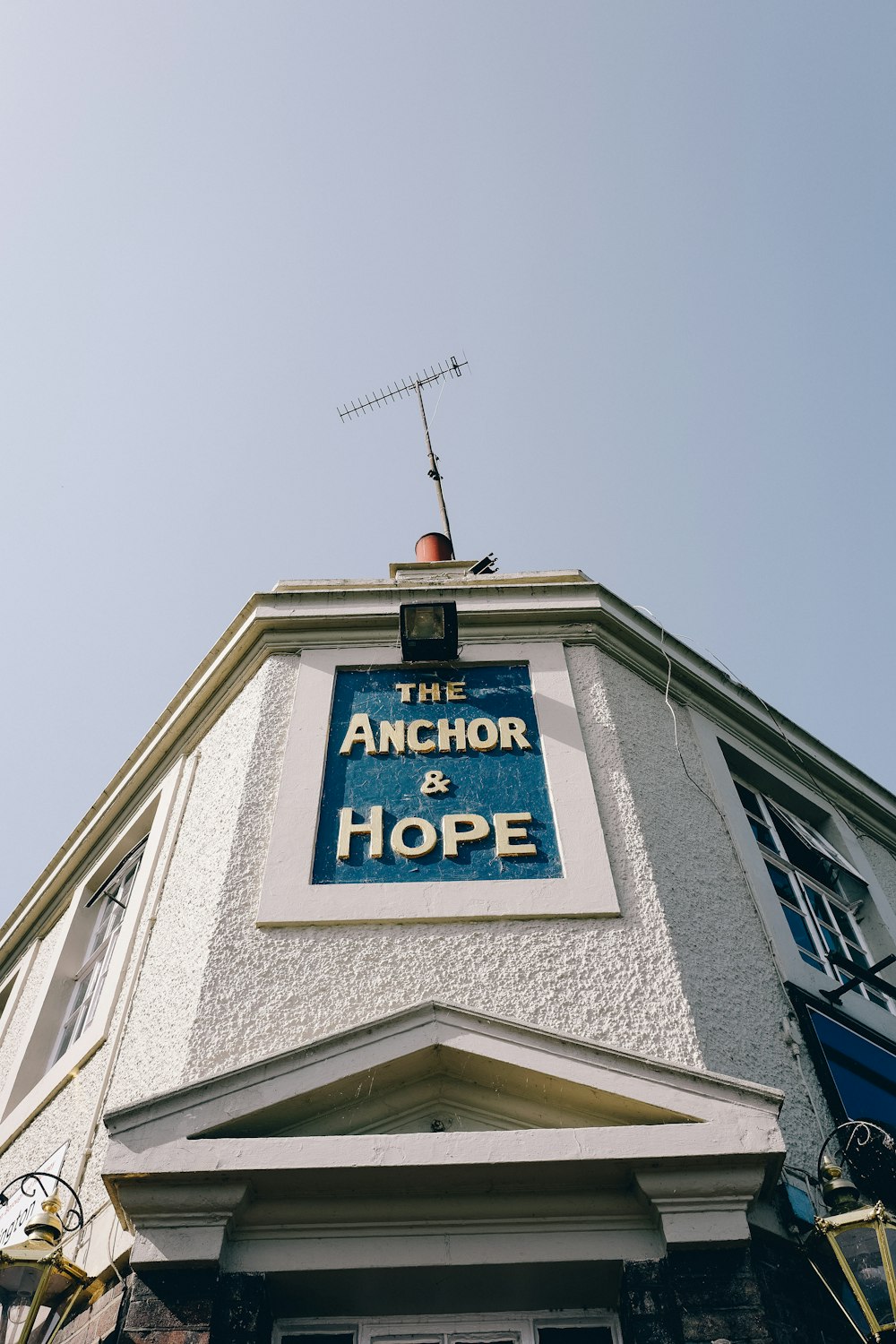 the anchor and hope sign on the side of a building