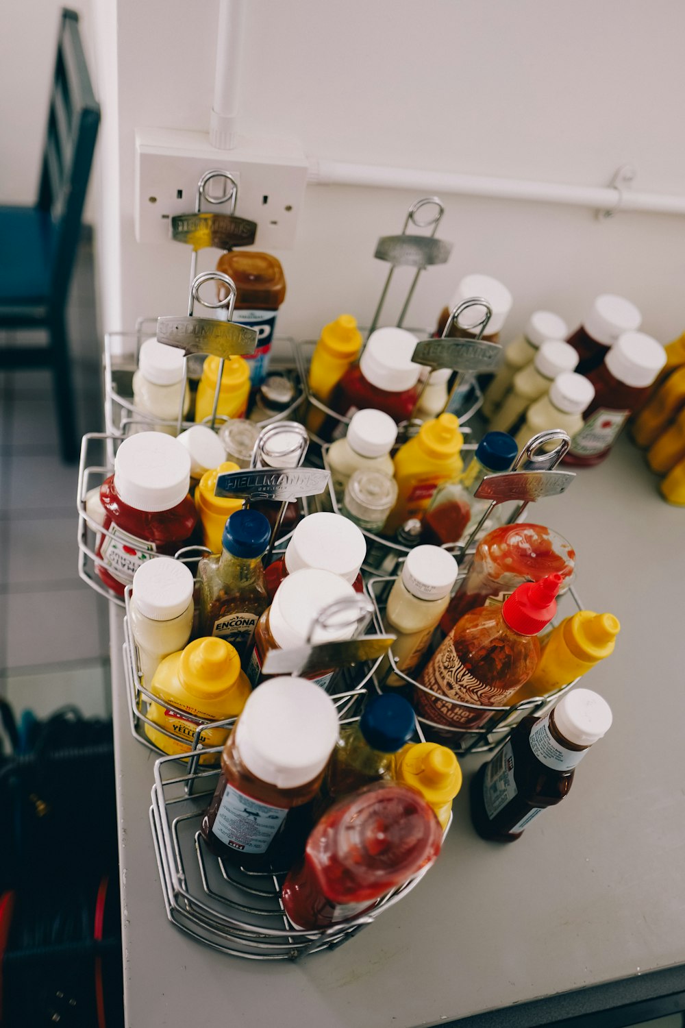 a metal basket filled with lots of condiments