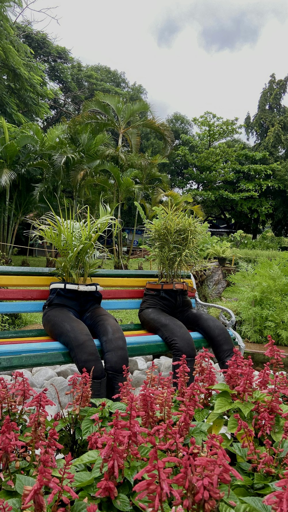 a couple of people that are sitting on a bench