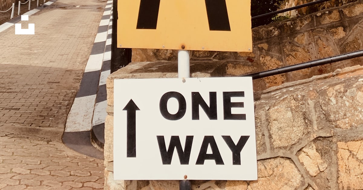 A one way sign on the side of a road photo – Free Nyanga Image on Unsplash