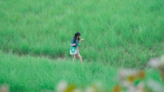 A person carrying an eco-friendly jute bag while walking through a green park.