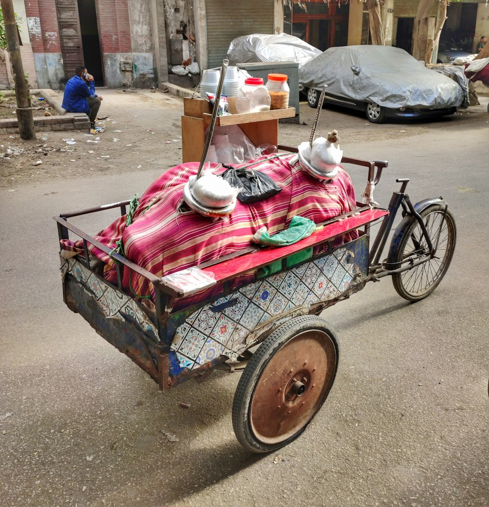 a bicycle with a blanket on the back of it