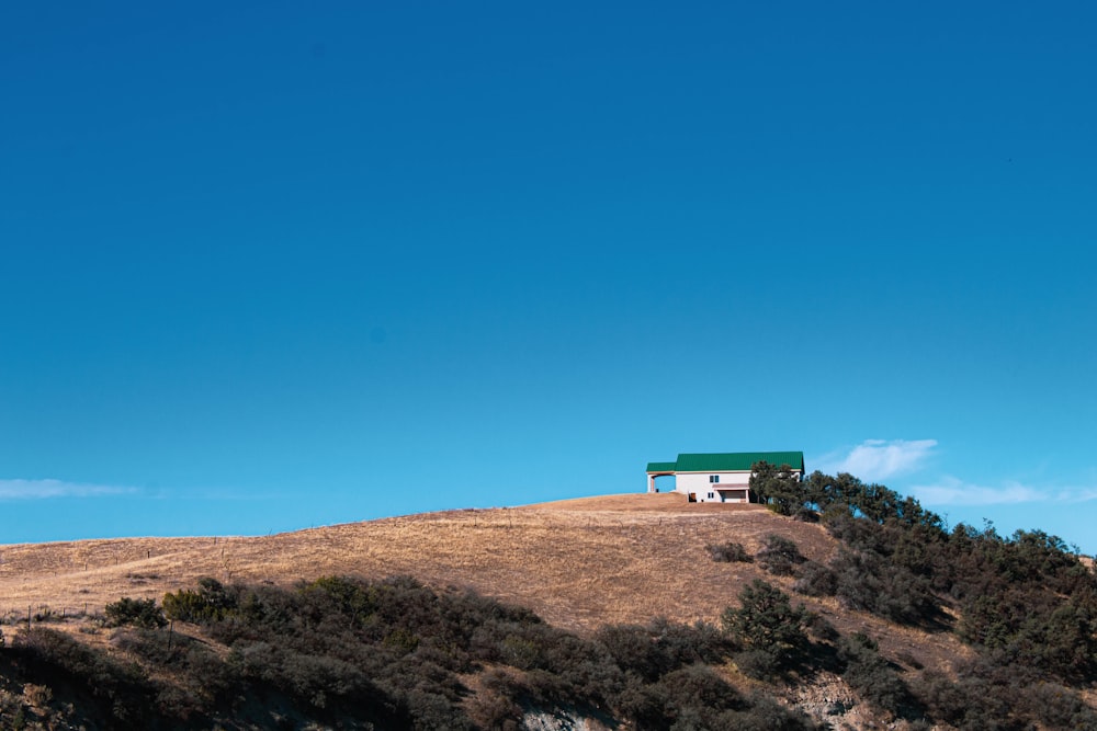 a house sitting on top of a hill