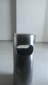 A modern bathroom trash can in a sleek design.