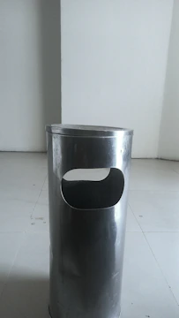 Stylish and durable trash bins placed in a hotel lobby area.