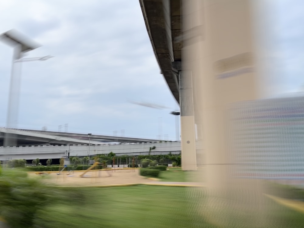 a blurry photo of a building and a wind turbine