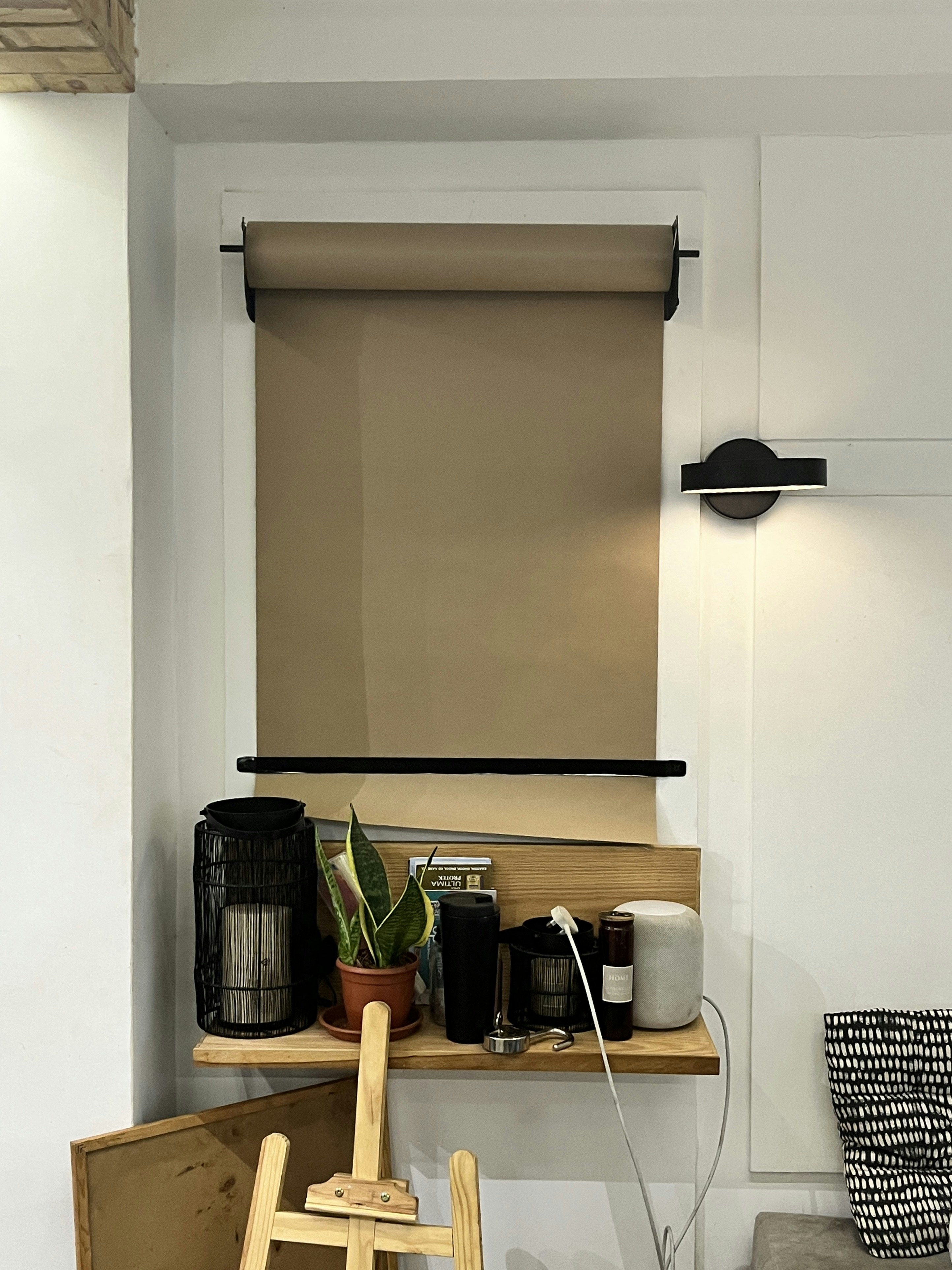 a room with a chair and a shelf with items on it