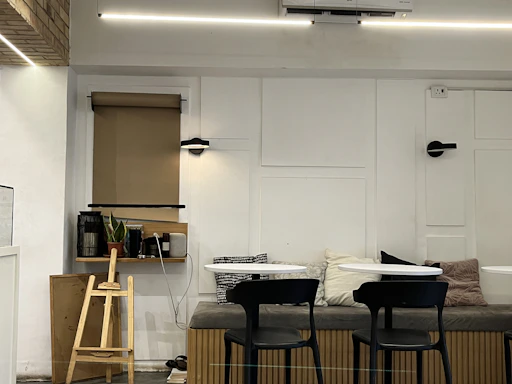 Warm and inviting reception area at Troff's Bukit Jalil homestay, showcasing minimalist decor.