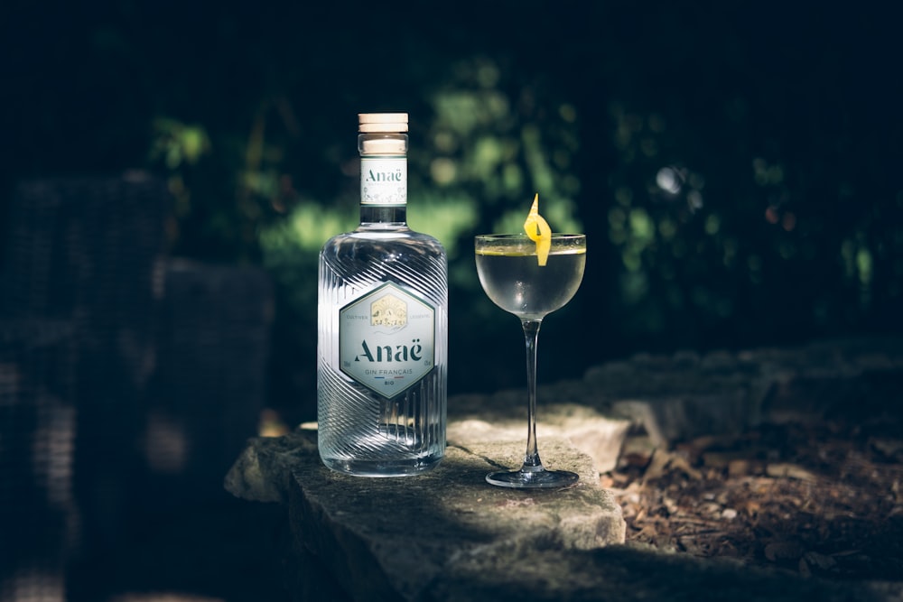 a bottle of alcohol next to a glass