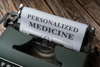 a typewriter with a paper that reads personalized medicine