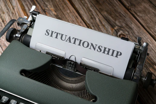 a close up of a typewriter with a sign on it