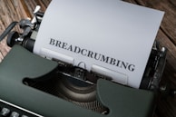 Close-up of vintage typewriter paper filled with unique barnabism words typed out.