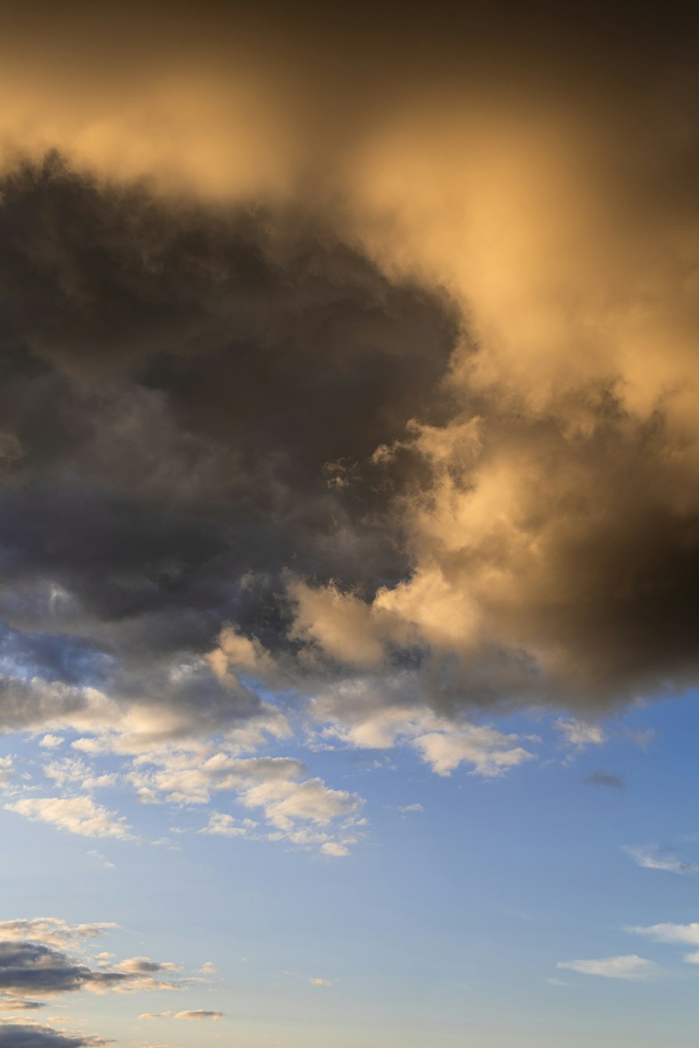 a plane flying in the sky with a lot of clouds