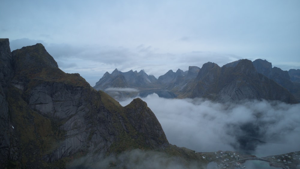 a view of a mountain range with low lying clouds