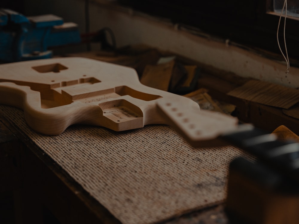 a close up of a guitar body on a table