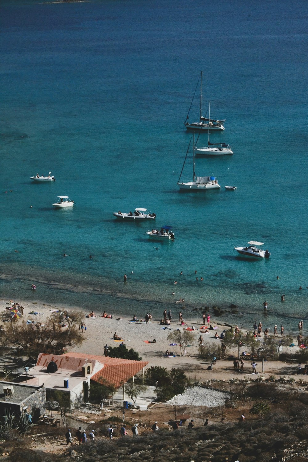 a group of boats floating on top of a body of water