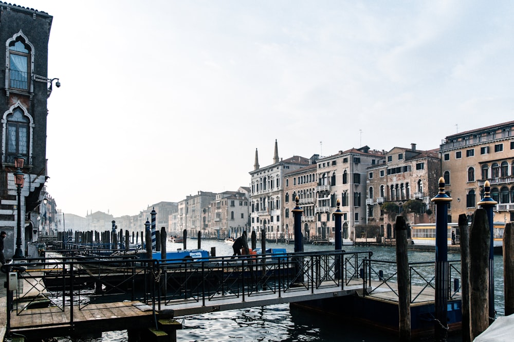 a bridge over a body of water next to buildings