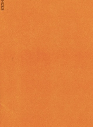 an orange piece of paper with a black border