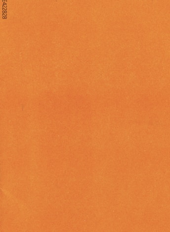 an orange piece of paper with a black border