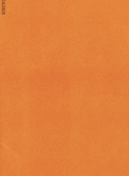 an orange piece of paper with a black border