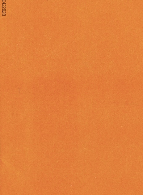an orange piece of paper with a black border