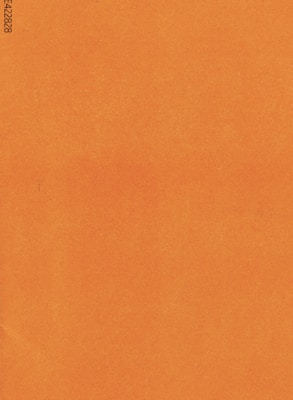 A plain, textured surface in a solid burnt orange color with a visible print of alphanumeric code in the corner.
