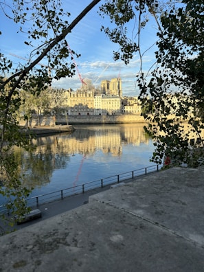 The historic facade of Craven Cottage with the River Thames in the background.