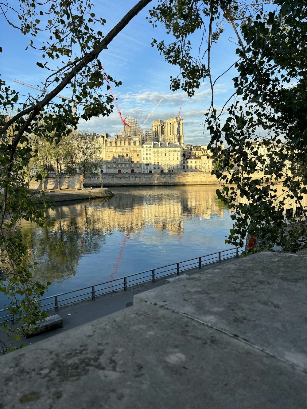 a view of a large building across a river