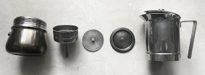 A Jura coffee machine mid-disassembly showing intricate internal components during maintenance.