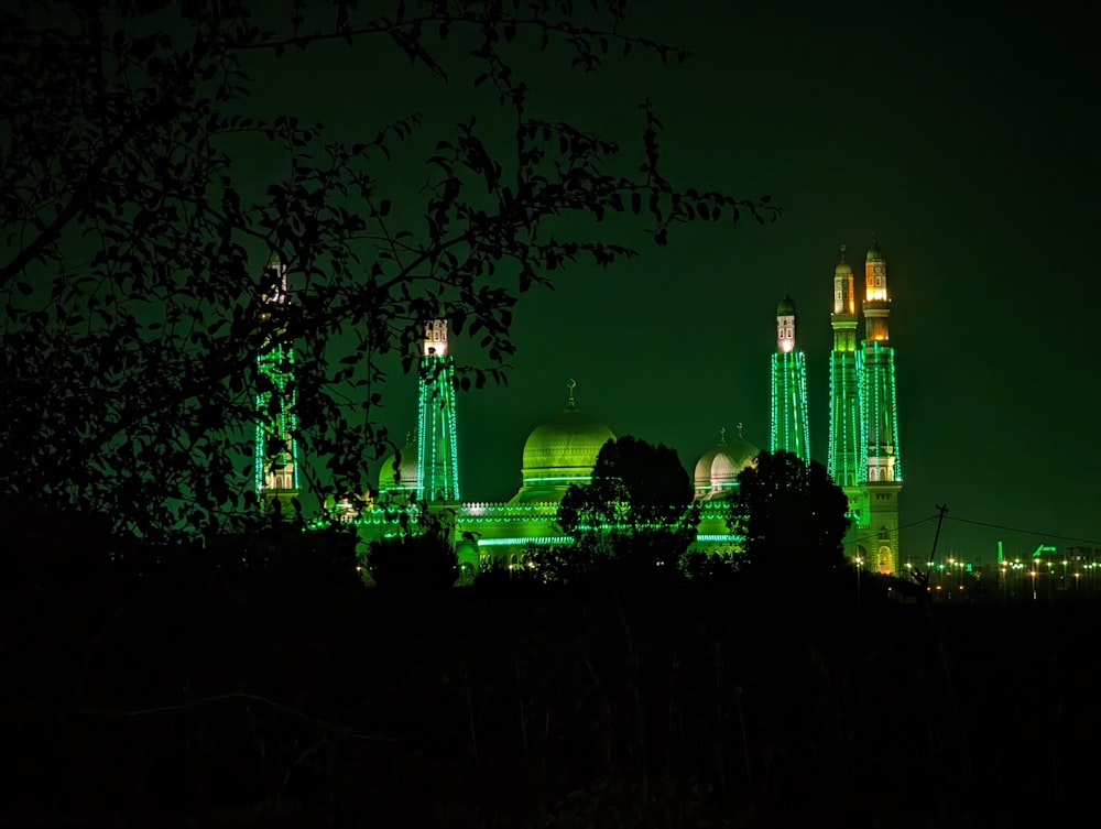 a night view of a city with green lights
