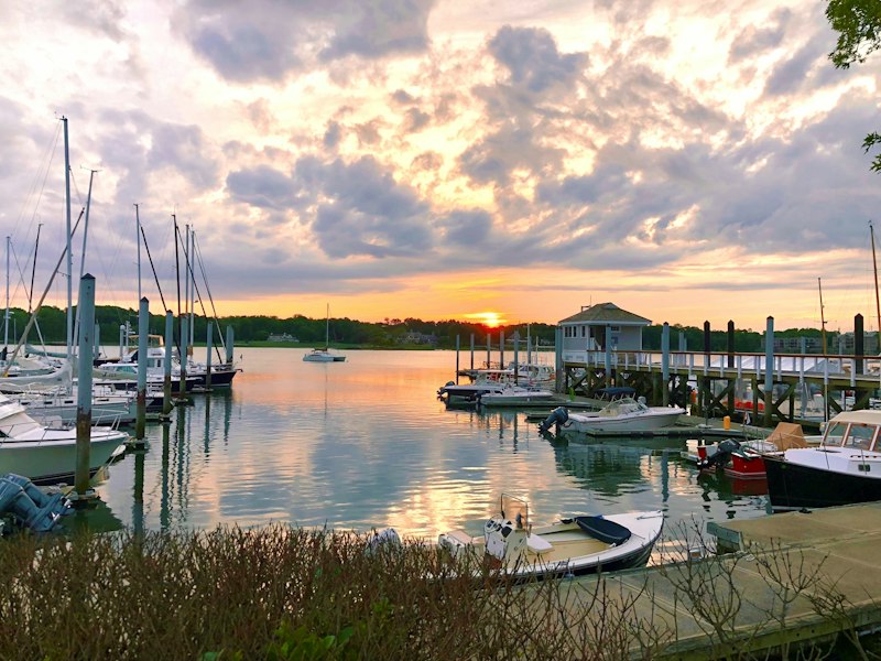 Connecticut coastal harbor with boats and a New England shoreline