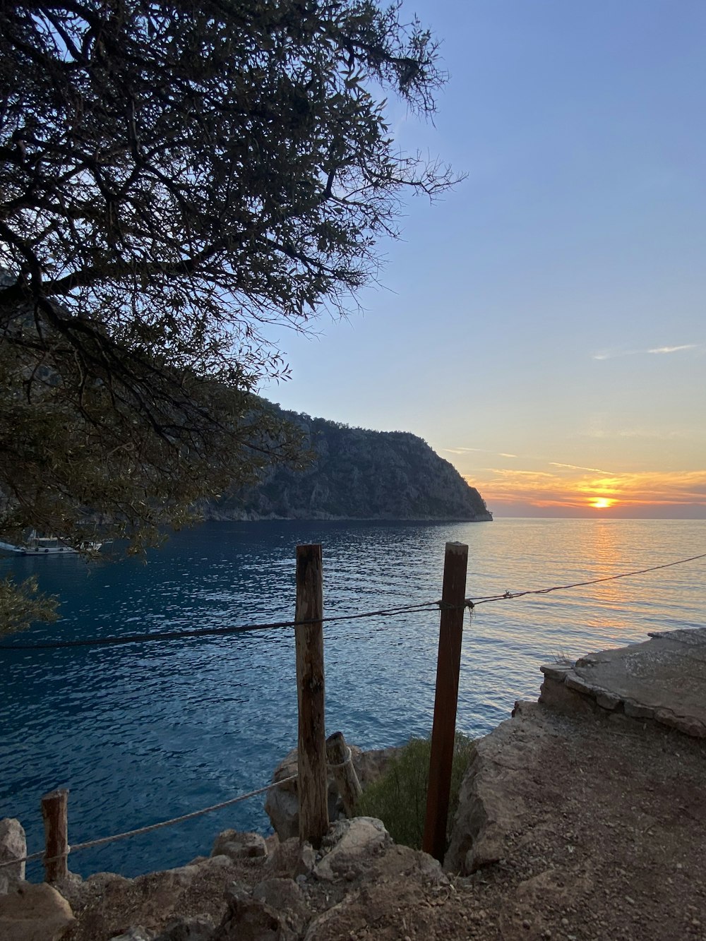 a view of a body of water at sunset