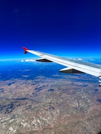 a view of the wing of an airplane in the sky