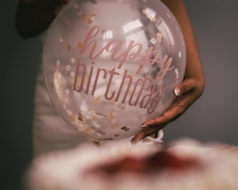 Close-up of vibrant balloon arrangements spelling out celebration.