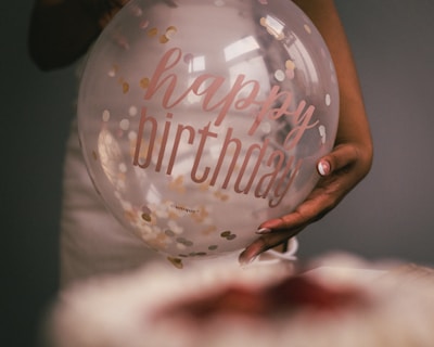 Close-up of a handcrafted birthday banner with vibrant letters and stitched details.