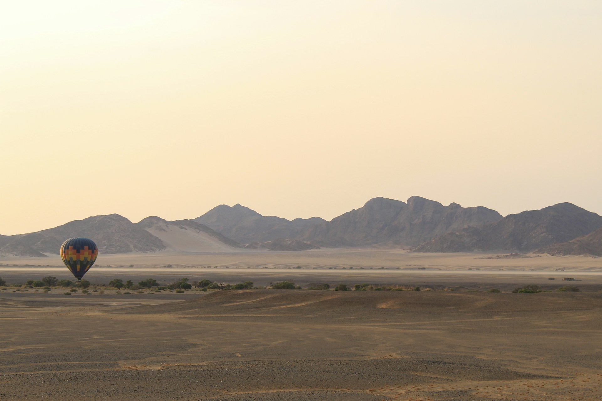 a hot air balloon in the middle of a desert
