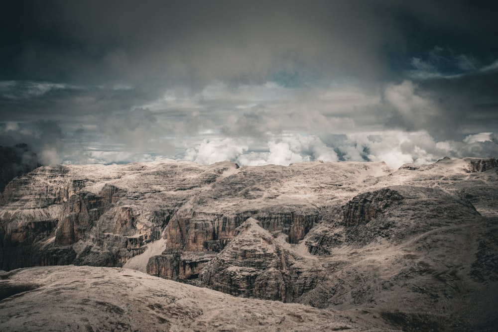 a view of a mountain range under a cloudy sky