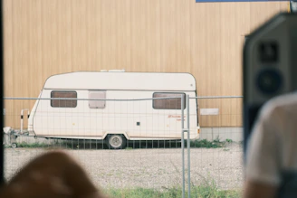 A technician inspecting a caravan for pests.