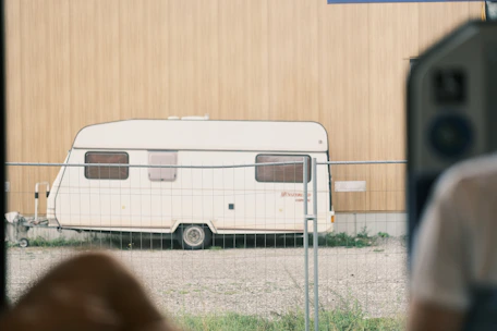 A technician inspecting a caravan for pests.