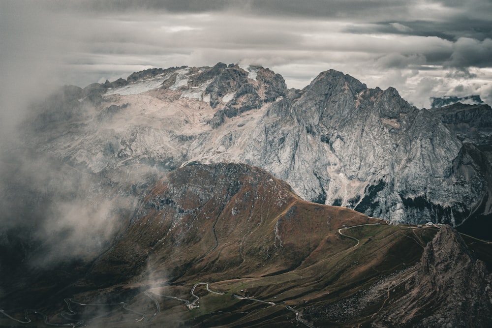 a view of a mountain range with a cloudy sky