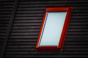 Stylish window frame being fitted in a contemporary house exterior