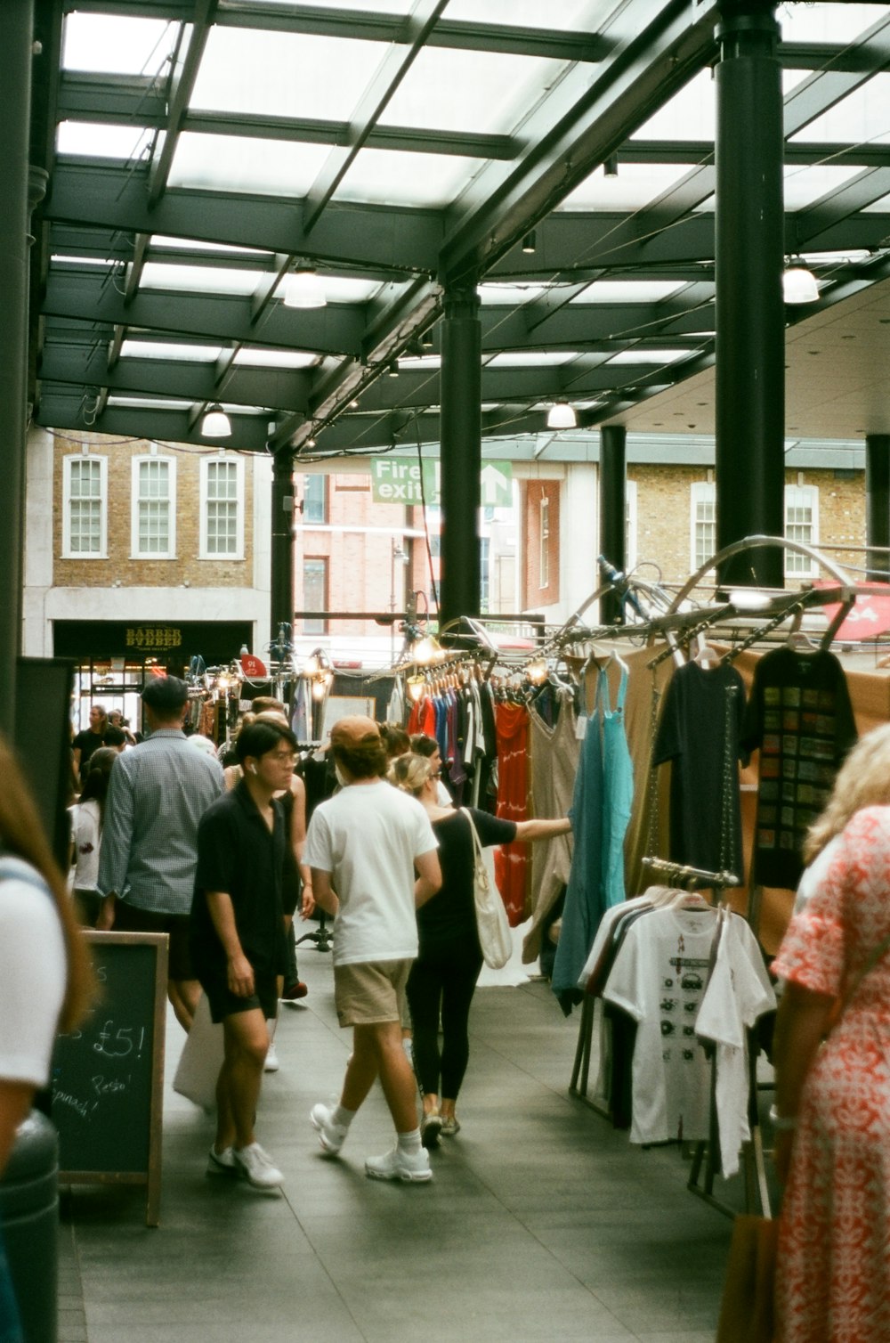 a group of people walking around a store