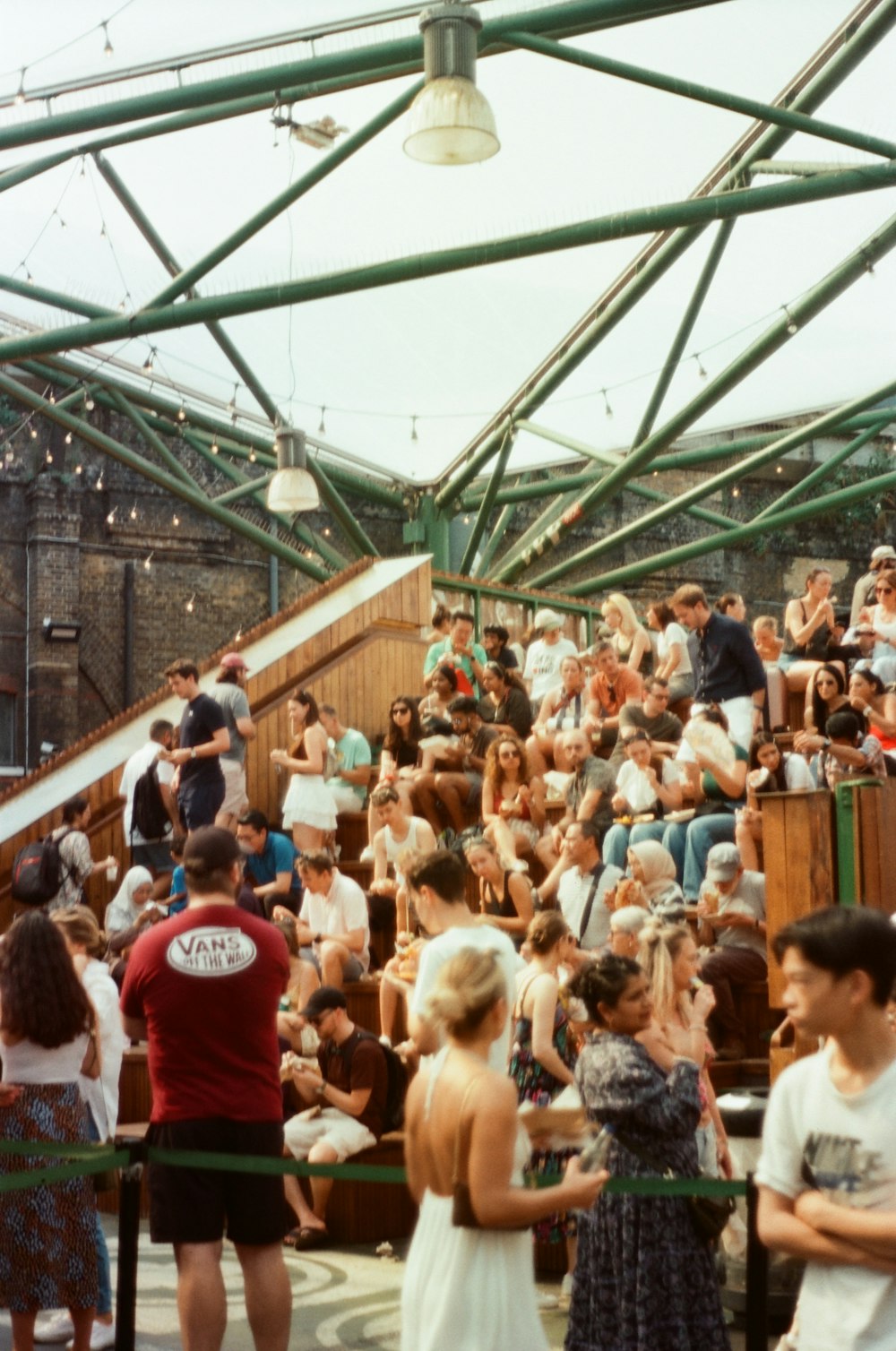 a group of people standing around each other