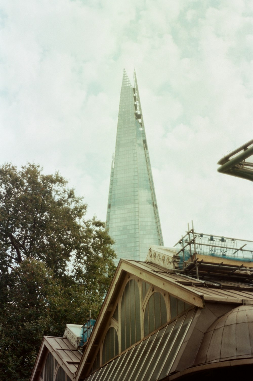 a very tall building with a sky line in the background