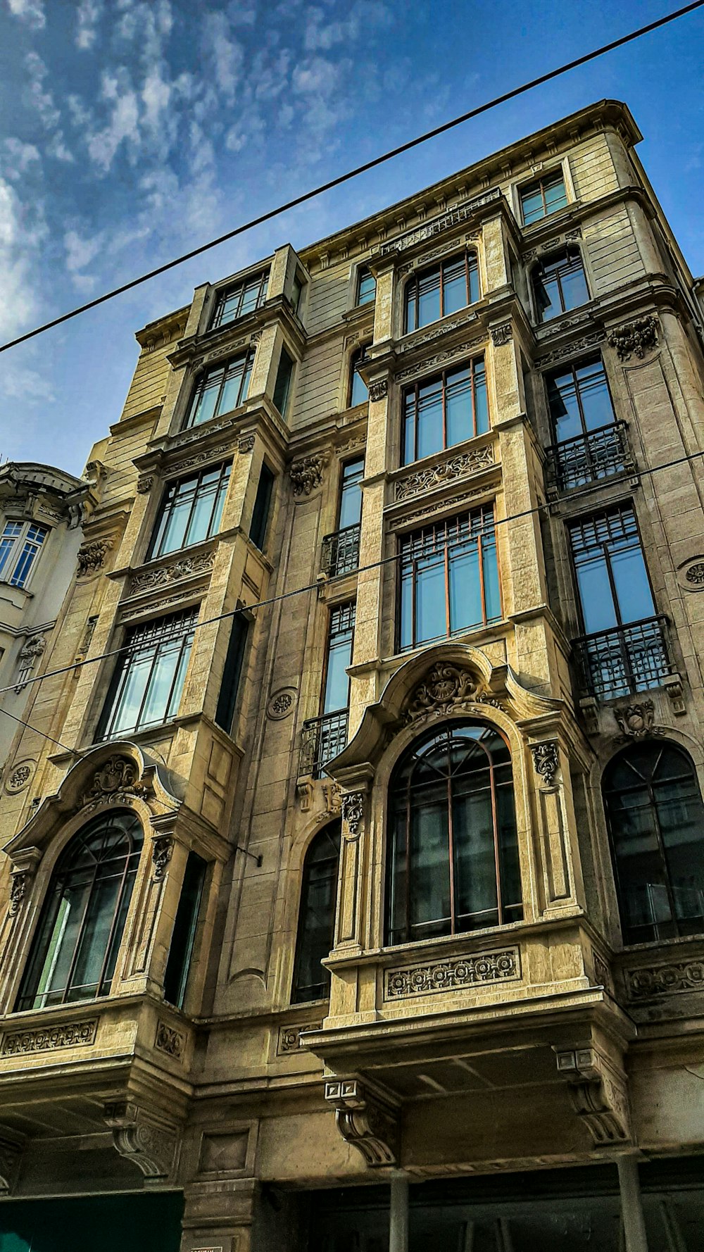 a large building with many windows and a clock on the front of it