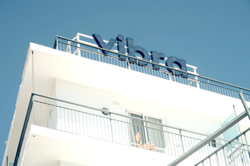 a white building with a sign on top of it